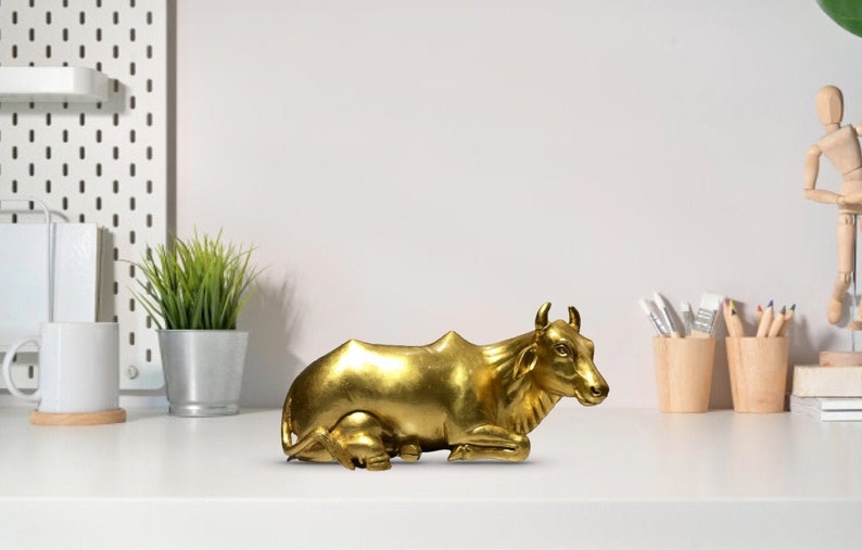 The Golden Cow, Wooden Pure Gold Plated Sitting Cow Statue - Malji Arts